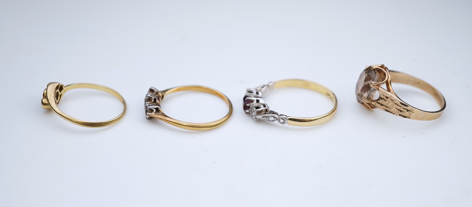 Four gem-set rings